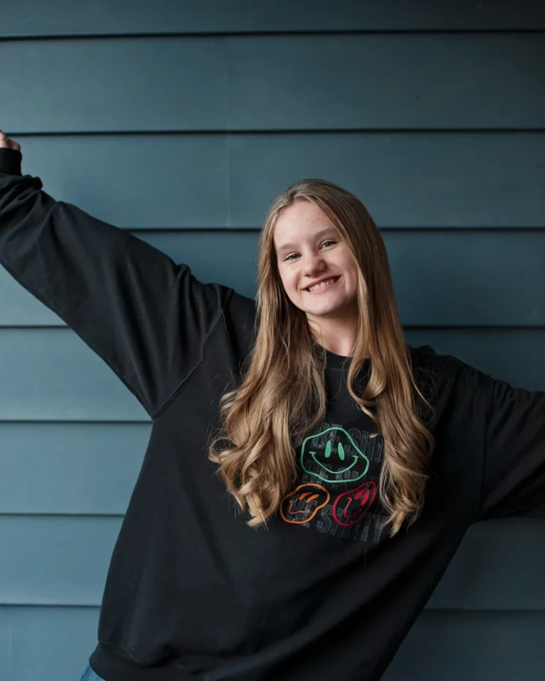 Woman wearing the black DON'T BE SHITTY groovy crewneck sweatshirt