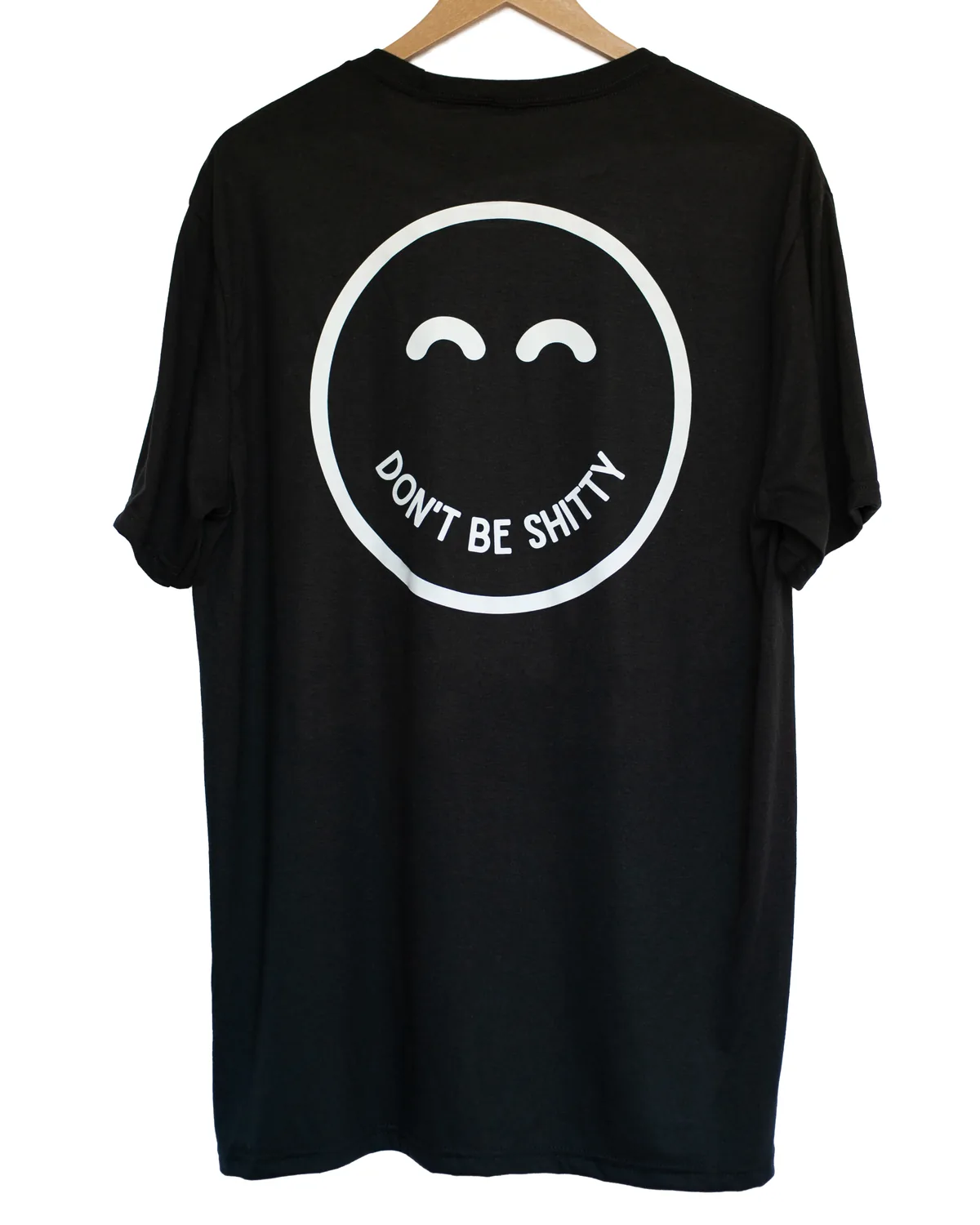 Back of the black DON'T BE SHITTY smiley t-shirt with the large smiley face print