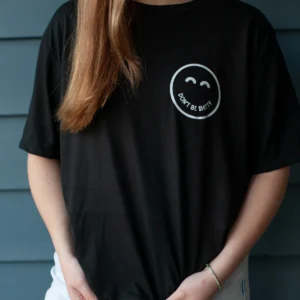 dbs-smiley-tee-black-worn-front Woman wearing the black DON'T BE SHITTY smiley t-shirt